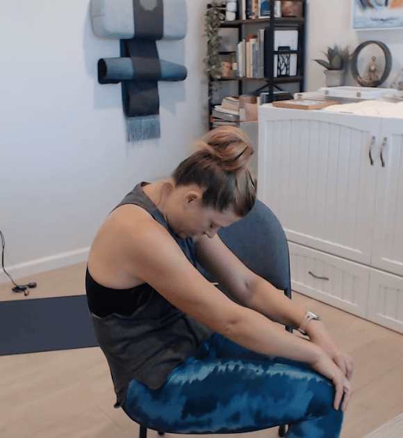 Shauna showing seated cat pose
